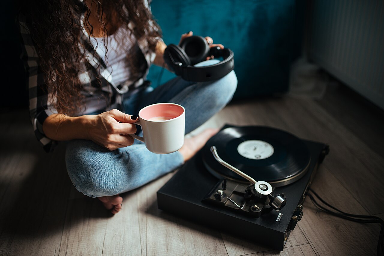 Enjoying a cozy afternoon with coffee and vinyl records at home