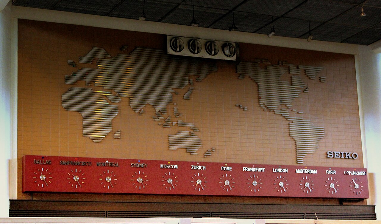WORLD MAP AND TIME ZONE CLOCKS AT DON MUENG AIRPORT BANGKOK THAILAND JAN 2013