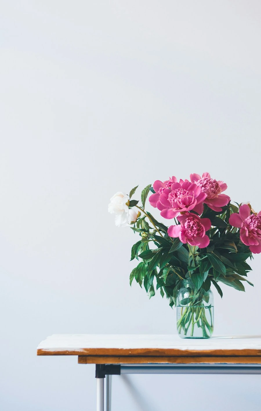 Pink flowers in a glass vase, a sample post