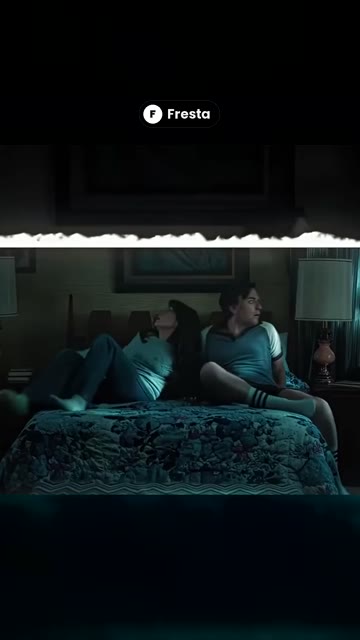 Two people sitting on a bed, a sample reel